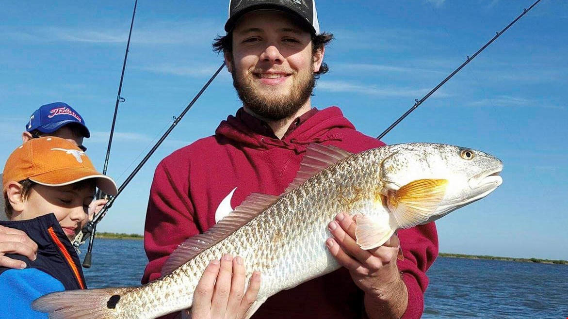 Solid Redfish coming to hand with Shannon C. and family. Capt. Chris Cady had the honors.